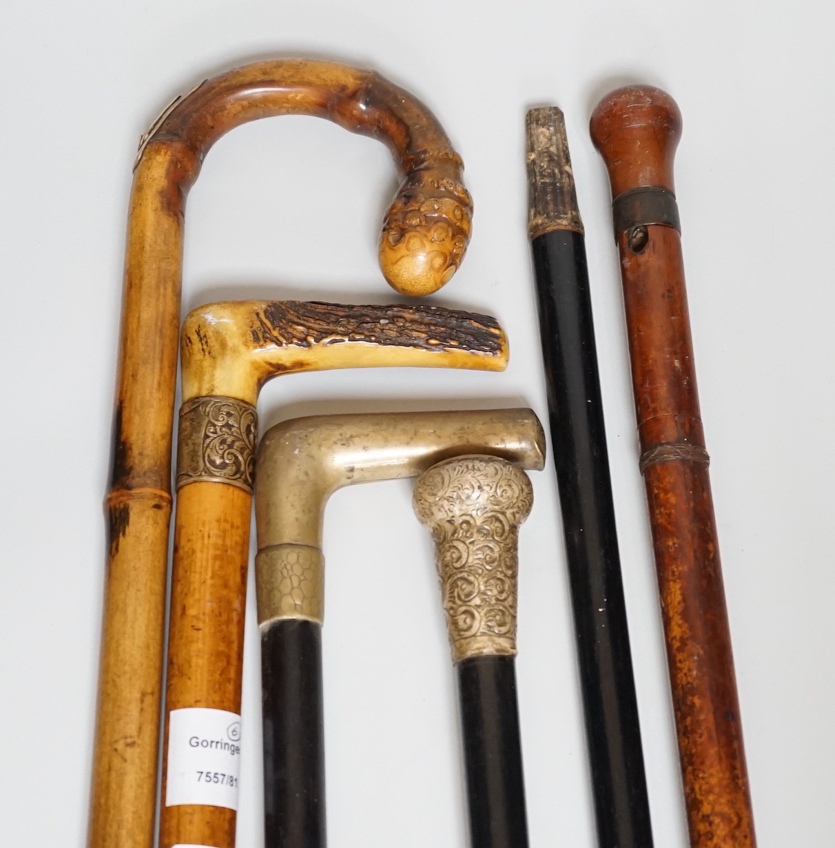 Two Victorian silver mounted walking sticks, a sword stick and three other sticks (6)